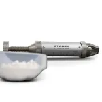 Stokes Tablet Hardness Tester next to a small container of white tablets.