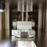 Close up photo of punch on Stokes Model 591 single station tablet press.