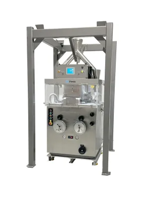 Custom frame surrounding a Stokes tablet press machine.