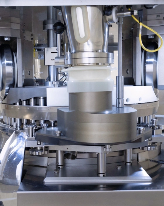 Close up of the hopper/feeder area of Stokes 720 rotary tablet press.